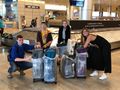 Arrived! Our Saran wrapped luggage
