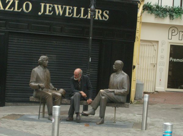 old man with statues