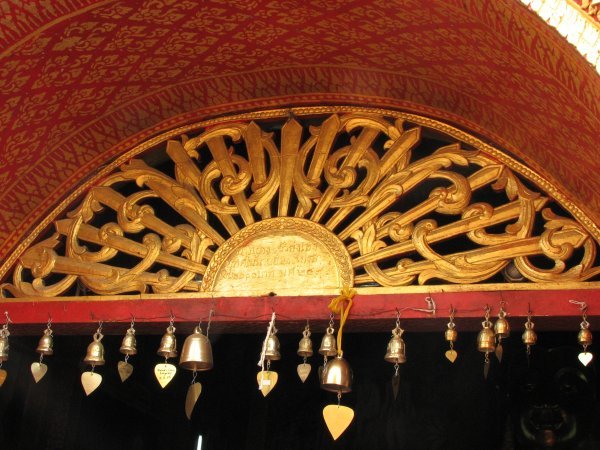 carved wood painted in gold on the door.