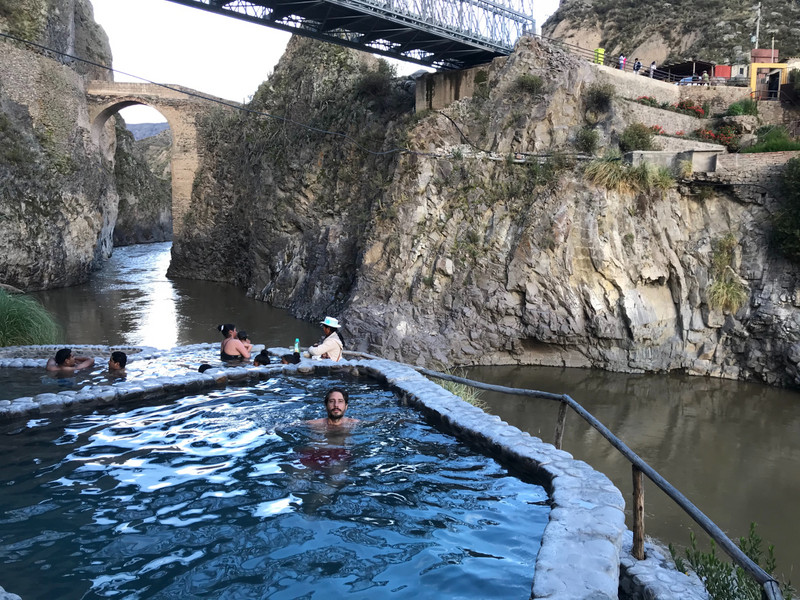 The natural hot springs overlooking the river