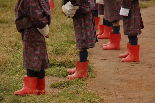 school children in rainboots
