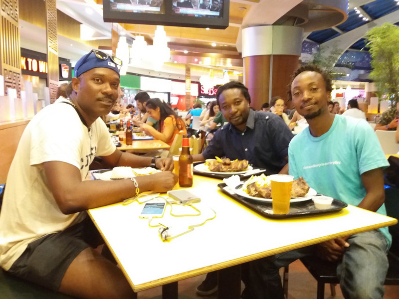 Eating with my Zimbabwean friends Clarence and Gerald in Lisbon