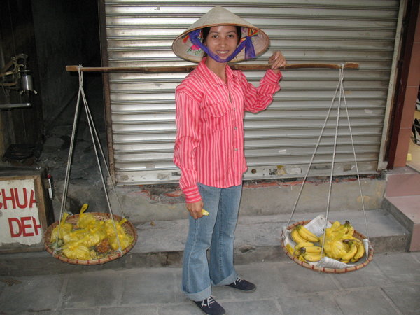 a local selling fruit in Hanoi