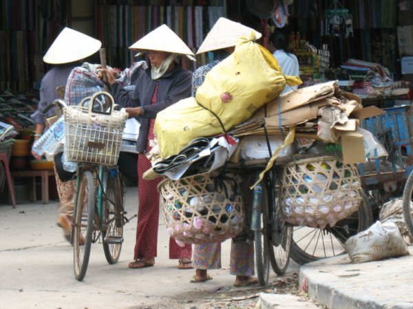 women getting their bicycle ready in Hoi An