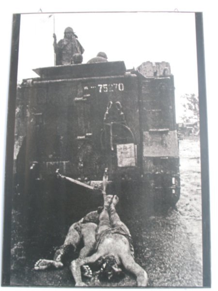 War Remnants Museum photo: Americans dragging dead Vietnamese bodies