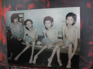 War Remnants Museum photo: A mom with her three sons; effects of the toxic chemicals dumped by the USA