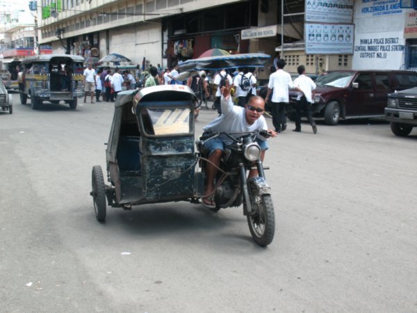 a tricycle in Manila (the "cheaper" taxi's)