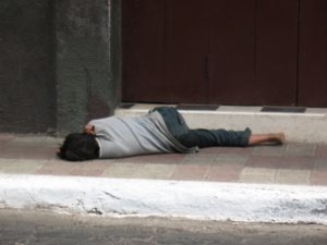kid sleeping on the street in Leon