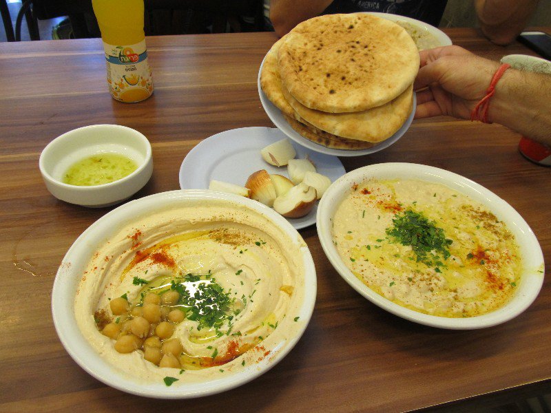 Trying some hummus (left) and masabagah (right) in Tel Aviv (Abu Hassan restaurant)