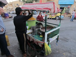 Madaba; vendor selling warm corncobs