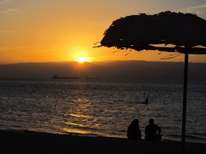 Sunset in the hills of the Sinai in Egypt, seen from the beach at the Red Sea, south of Aqaba