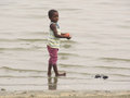 Little girl washing clothes at Lake Bosomtwe
