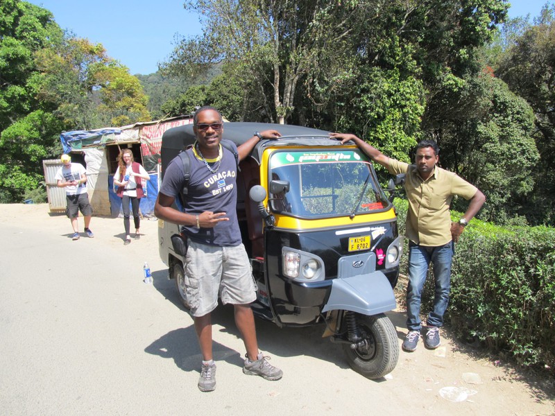 With the driver and his auto-rickshaw 