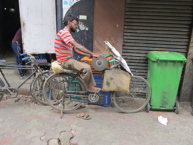 Man at work on the street in Mumbai