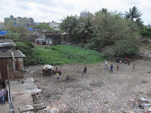 Playing cricket in Dharavi, slum in Mumbai