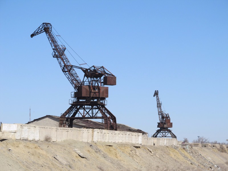 Abandoned cranes in the harbour of Aralsk