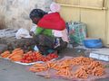 Women selling her vegetables along the street