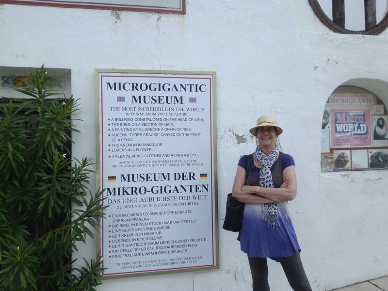Next to a sign for one of those quirky museums