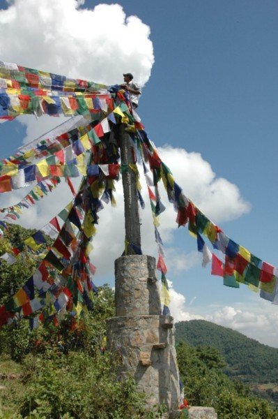 Our guy come guide hanging our prayer flags