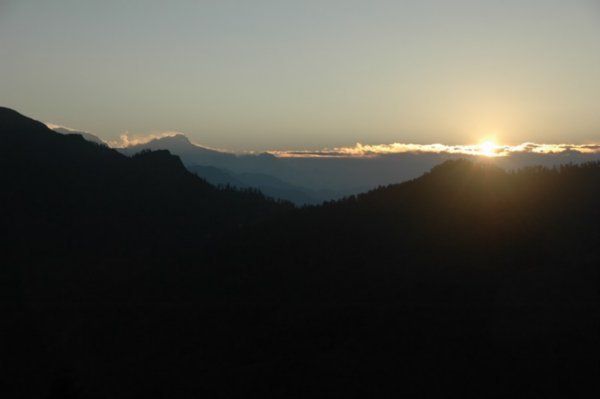 And the sun slowly peaks over the mountains - view from Poon Hill
