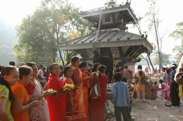 Queuing to make offering at temple on island