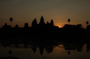 Sun peeking over ·Angkor Wat