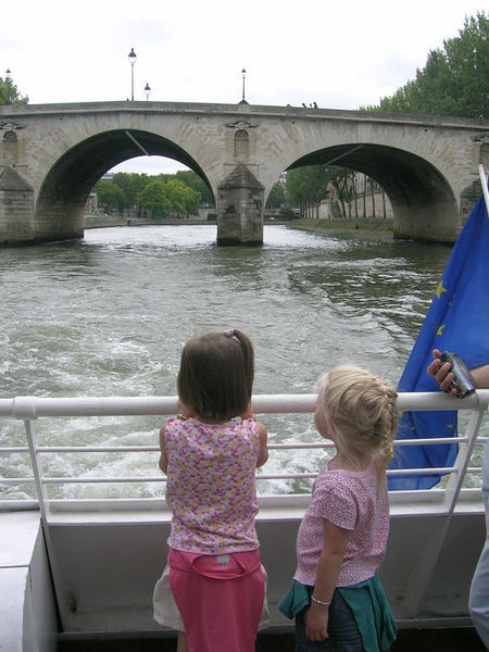 Girls riding a boat on the Seine