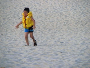 Child Running in Life Vest