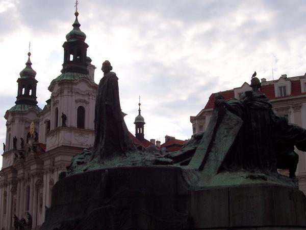 Statue and building on old town square