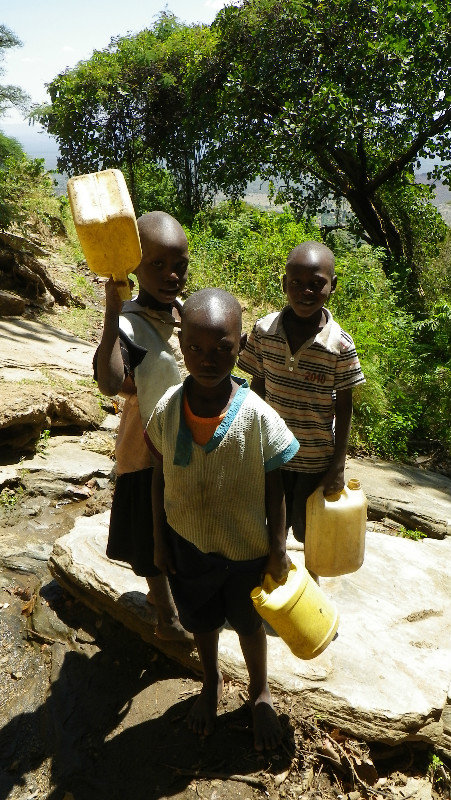 Kids collecting water