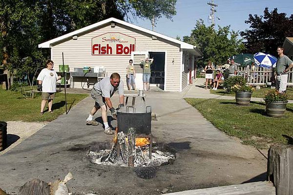 Fish Boil  bell adding fuel to the fire