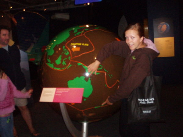me pointing out oz & nz on a globe showing the 16 plates of the earth!!!!!!