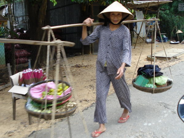 Woman Carries Things to Sell Near Hue' 