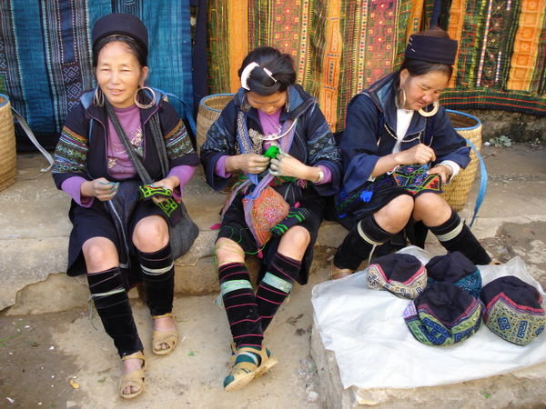 Women Knit Traditional Wares To Sell At Market