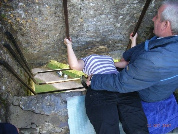 Sarah bending over backwards to kiss the Blarney Stone