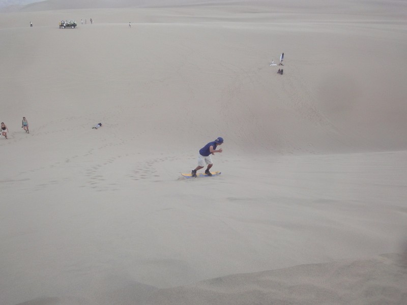 Sandboarding Down The Dune