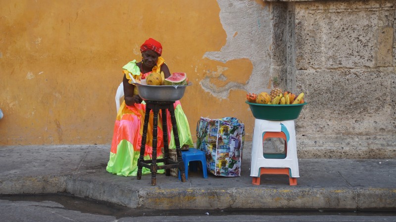 Fruit Seller In Colourful Attire