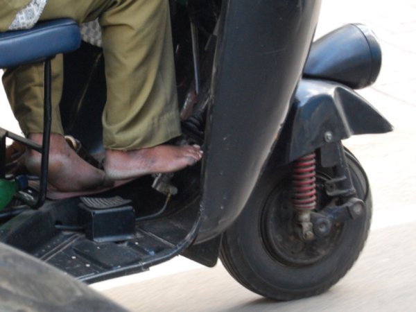 Auto Rickshaw Drivers go barefoot.