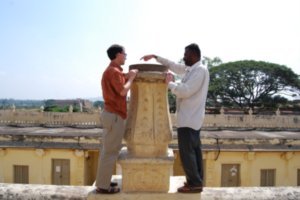 Craig learns about the sundial at Srirangapatna Masjid.