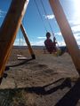 Swinging at the beach, El Calafate 