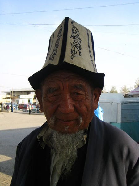 Bazaar Korgon - Man with the traditional Kyrgyz hat