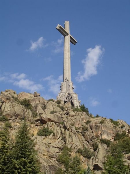 Cross monument viewed from directly below and to one side of the church