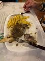 Greek lamb cooked in lemon. With chips, we are no longer surprised.