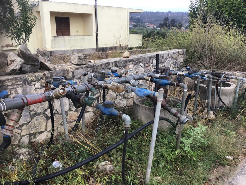 Vamos. The local plumbing system. Water pump numbers are how houses are located as most streets do not have names.