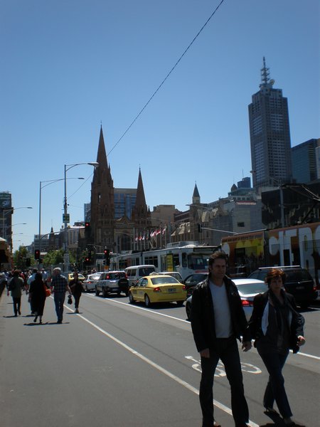 On the bridge by Flinders Street Station.