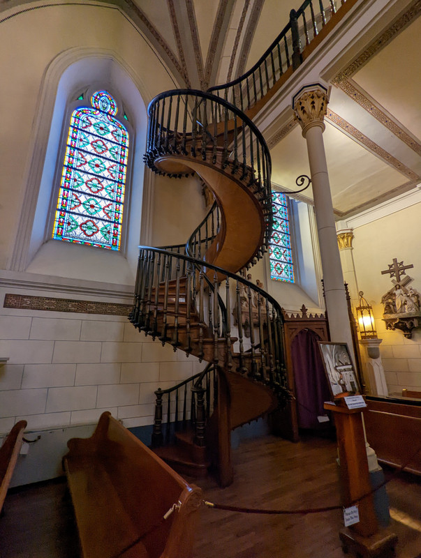 Which is famous for its unlikely spiral staircase, which seems to be in place without a visible means of support. From what I understand it is an astonishing display of woodworking skill, built in 1877 with wooden pegs and rudimentary tools..