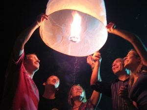 Launching a lantern during moon festival