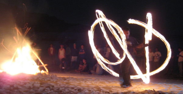 Performing fire juggling
