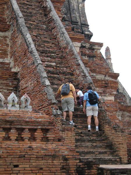 Climbing some steep steps at Ayutthaya