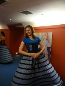 I try on the corset and big hoop skirt frame...